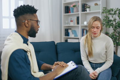 a woman talking to a psychologist