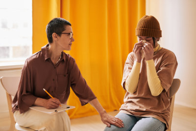 psychiatrist comforting the woman