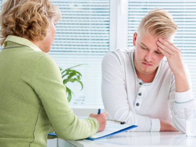 man and psychiatrist having a therapy session